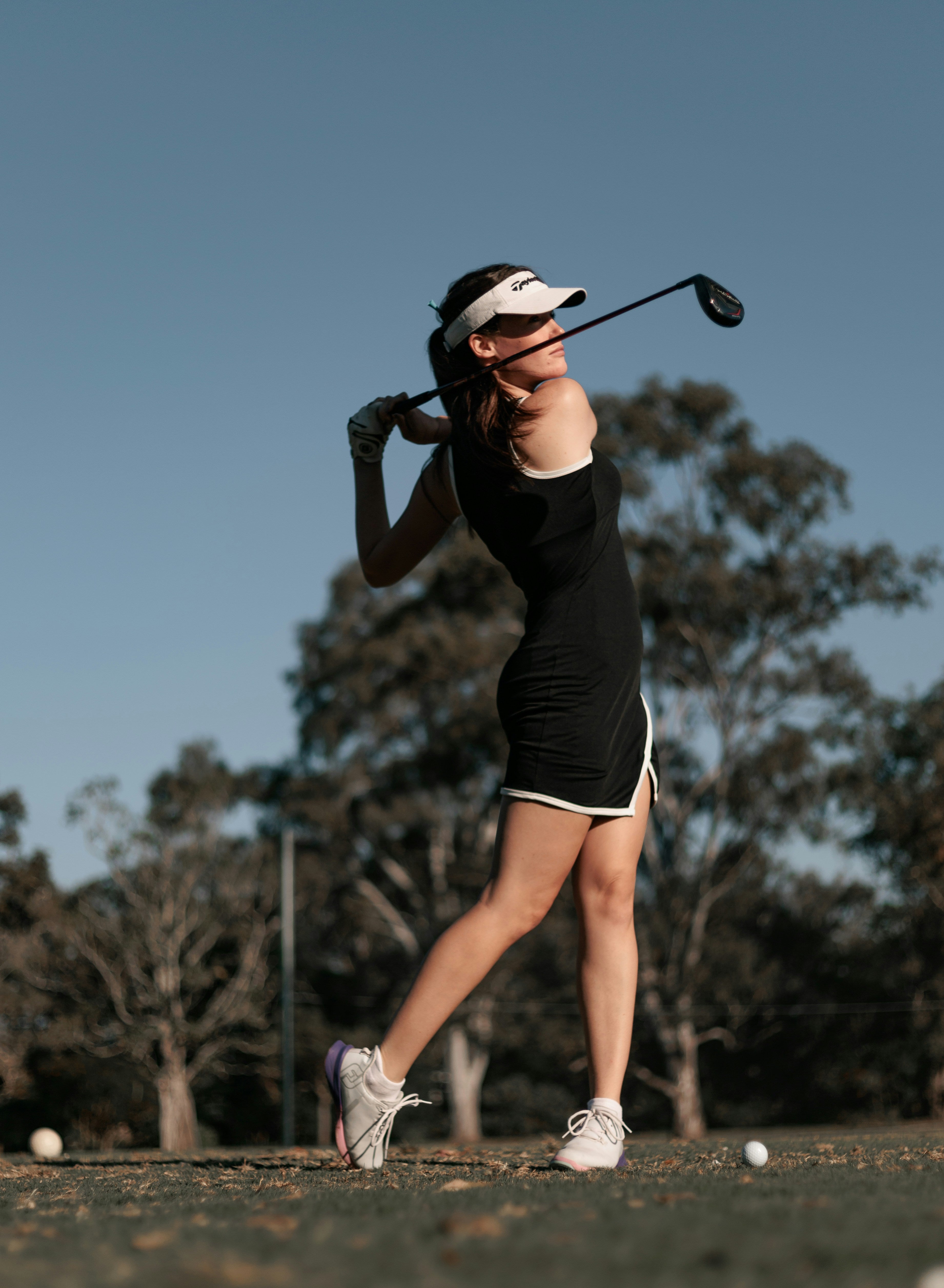 Female golfer competing with confidence and mental focus on course Mack Mental Performance mental performance coaching Tampa Bay